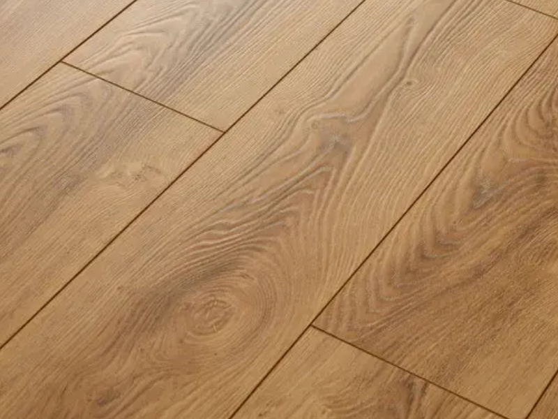 young family entering empty house with new floors
